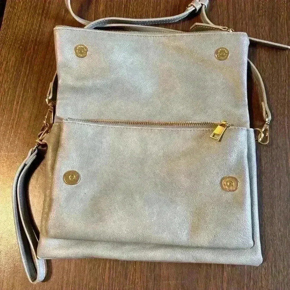Grey Fold over Purse. Wristlet Strap. Shoulder Strap. Pockets. Zipper. Snap. - Picture 3 of 7